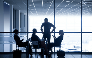 A group of accountant sitting around a table discussing a topic.