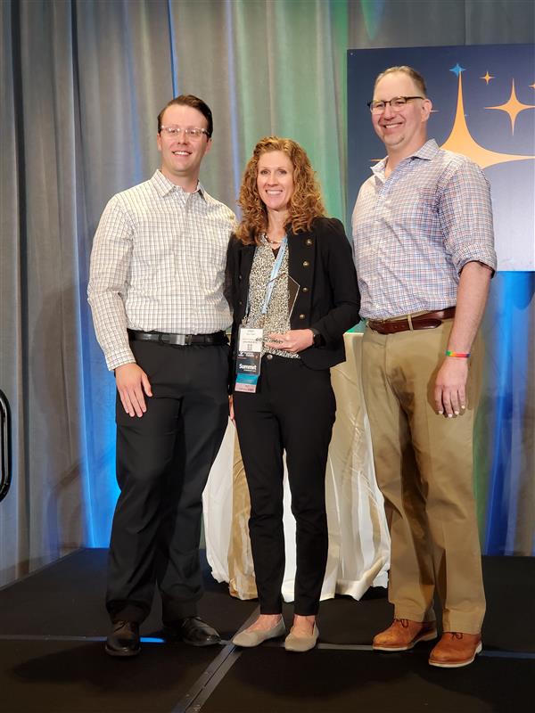 Stacy Dreher accepting the AAM Marketer of the Year award for 2024.