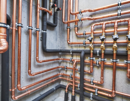 copper pipes of a private house autonomous heating system in boiler room.