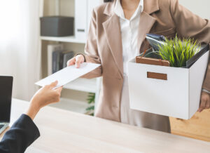 Unemployment quitting job, desperate young business woman send resignation letter to boss, resigning from company,holding belongs, pack stuff in box, layoff or leaving, changing work employment. Employee Offboarding Checklist 8 Actions Businesses Must Take